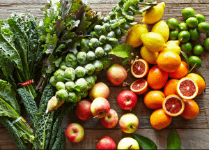 a group of fruits and vegetables on a wood surface Healthy Weight Loss Diets Borehamwood