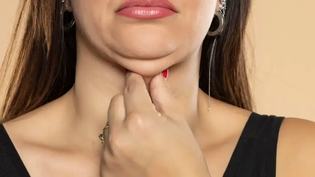 An image of a woman with double chin, sad, worried : Non Surgical Double Chin Removal Treatment in Borehamwood, UK